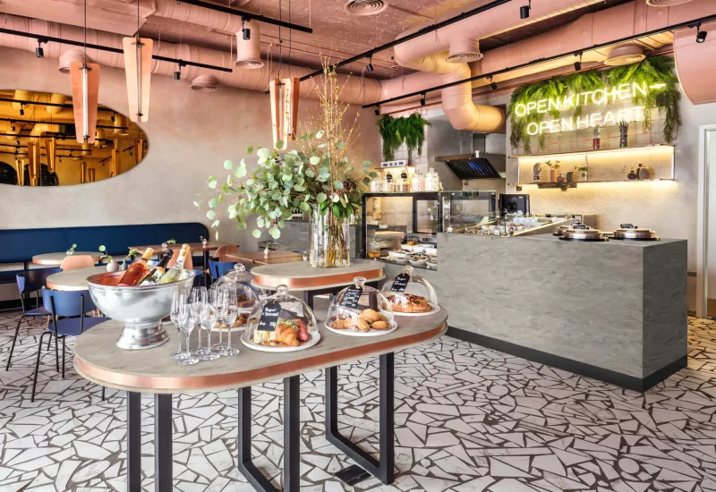 Barra y mesas en Corian® Solid Surface Ash Aggregate