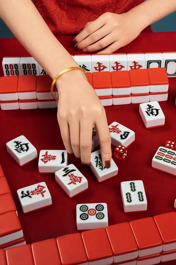 Woman,In,Cheongsam,Playing,Mahjong(majiang),,Close-up,,Traditional,Chinese,Mind,Game(translation: