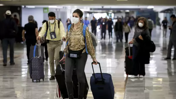 A stranded Peruvian tourist checks his phone at Cancun International Airport amid travel restrictions due to the outbreak of coronavirus disease (COVID-19) in Mexico