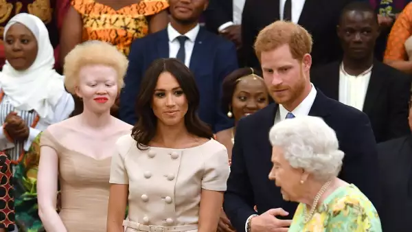 Meghan Markle, príncipe Harry y la reina Isabel II