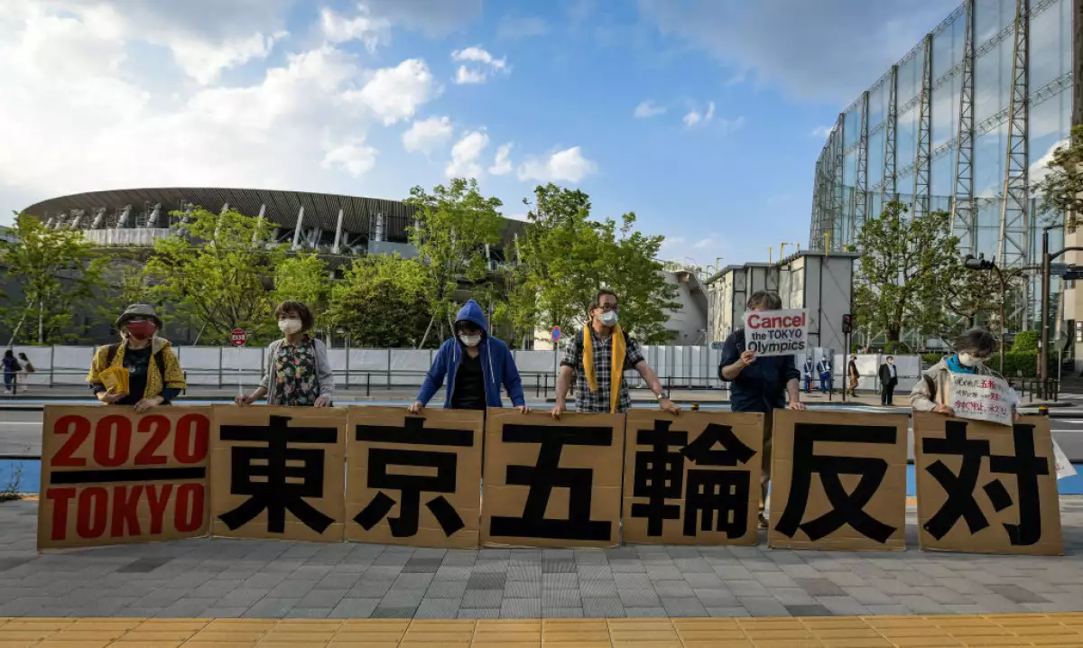 Protesters demonstrate against the Tokyo Olympics in front