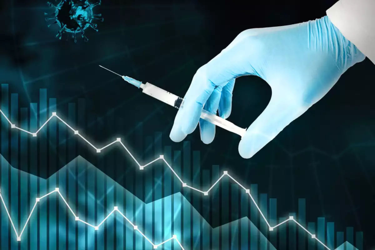Hand in blue glove holding syringe. Coronavirus vaccine concept. Stabilization of the global situation with pandemic.