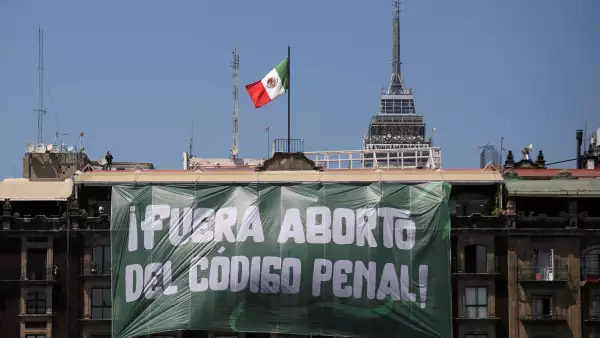 FILE PHOTO: A banner reading: "Abortion Out of the Penal Code" hangs from a building during International Women's Day, at the Zocalo Square in Mexico City, Mexico March 8, 2023. REUTERS/Quetzalli Nicte-Ha/