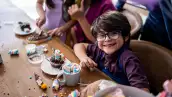 Portrait of a boy playing with sweets on a children's day at home