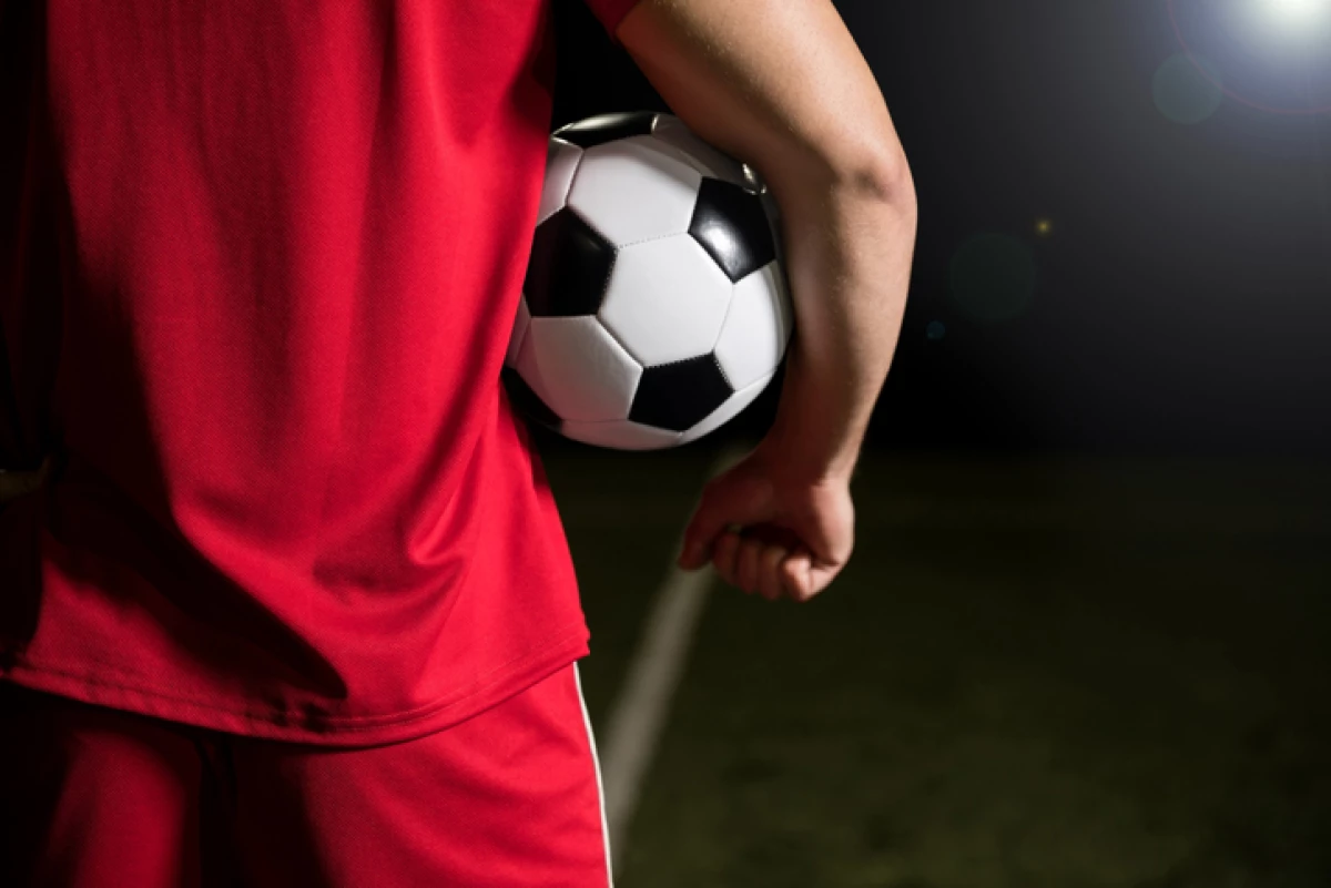 Football player with soccer ball