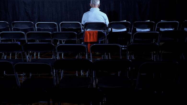 A man waits before the rally for Democratic presidential candidate Pete Buttigieg at Drake University in Des Moines in Des Moines, Iowa, U.S.,