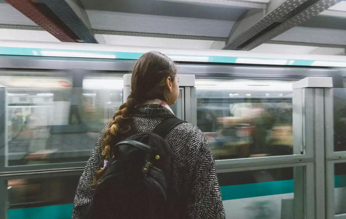 Young woman waiting the train in paris subway station