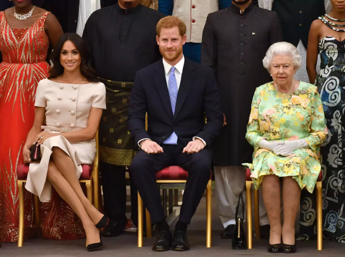 Meghan Markle, príncipe Harry y la reina Isabel II