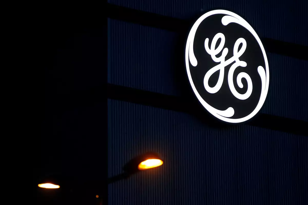 FILE PHOTO: The General Electric logo is pictured on the General Electric offshore wind turbine plant in Montoir-de-Bretagne