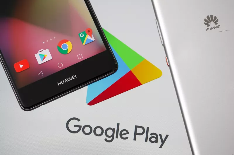 Huawei smartphones are seen in front of displayed Google Play logo in this illustration picture