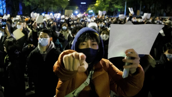 Vigil commemorating victims of a fire in Urumqi, in Beijing
