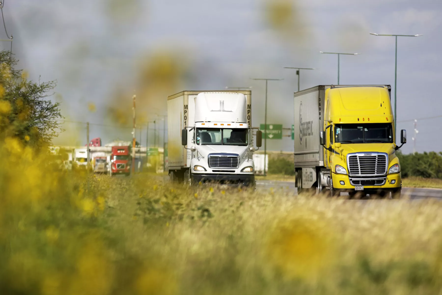 Trucks are seen before arriving at a border customs control to cross into U.S. at the World Trade Bridge in Nuevo Laredo