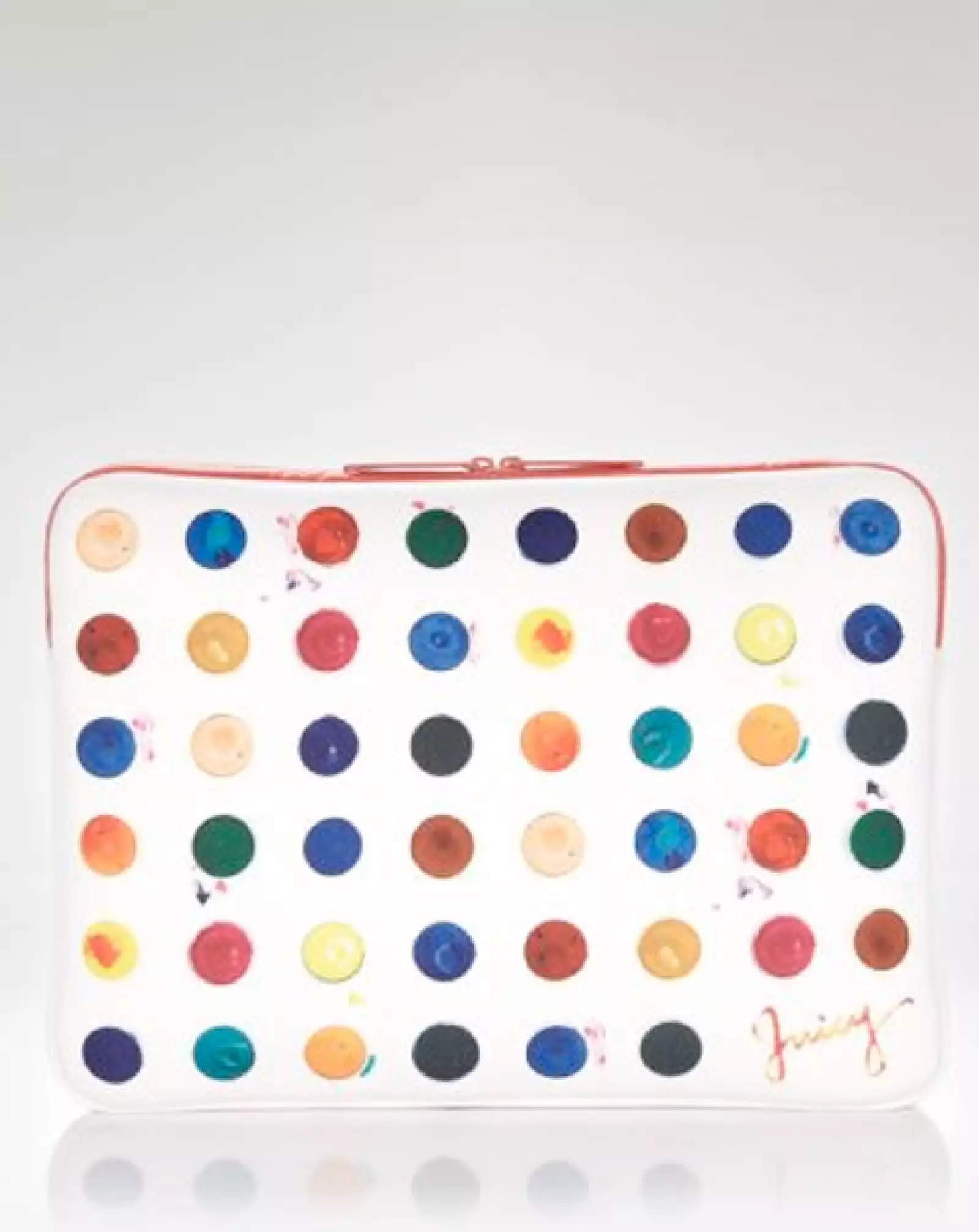 La firma Juicy Couture propone porta laptops con motivos circulares de colores.