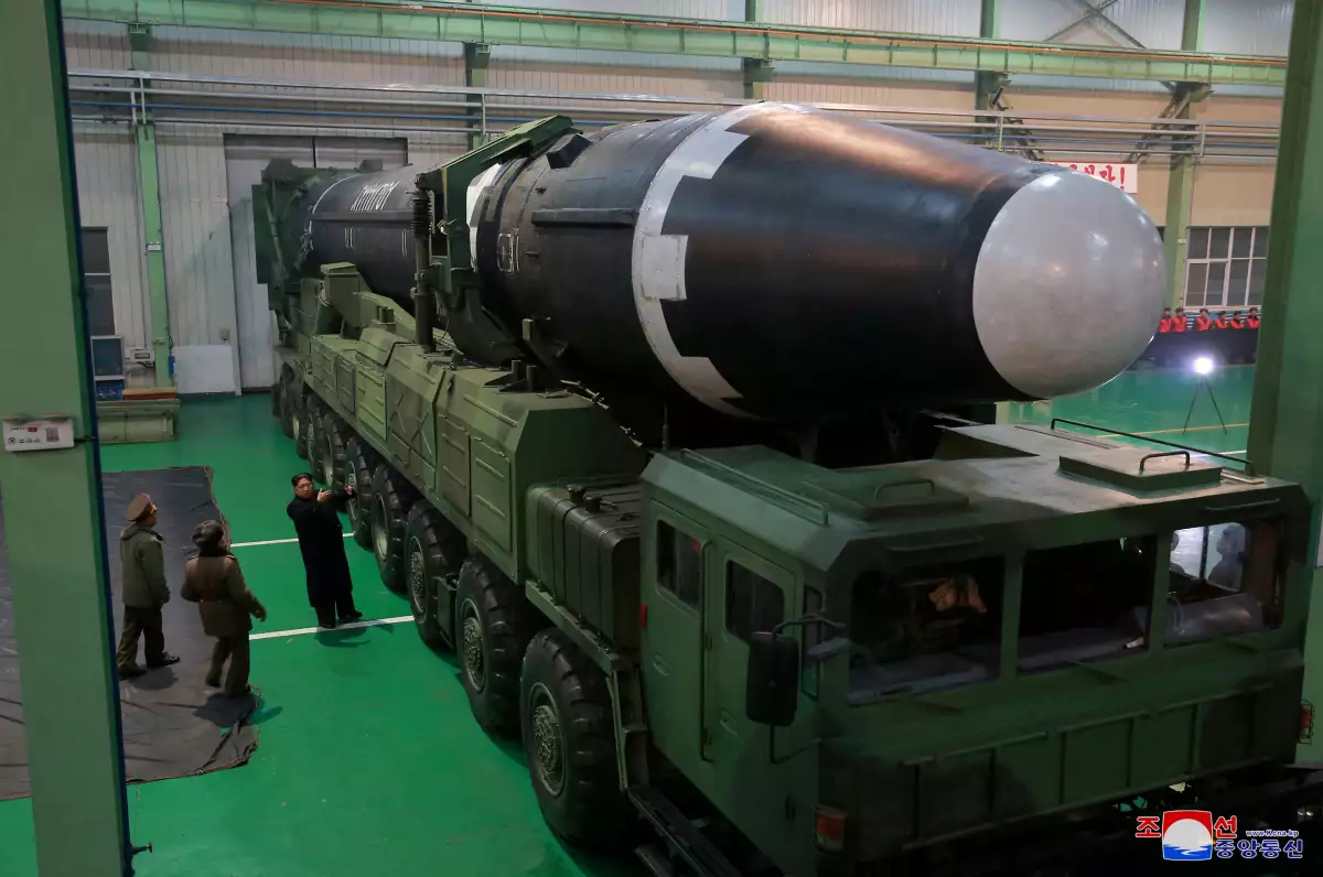 FILE PHOTO: North Korea's leader Kim Jong Un is seen as the newly developed intercontinental ballistic rocket Hwasong-15's test was successfully launche