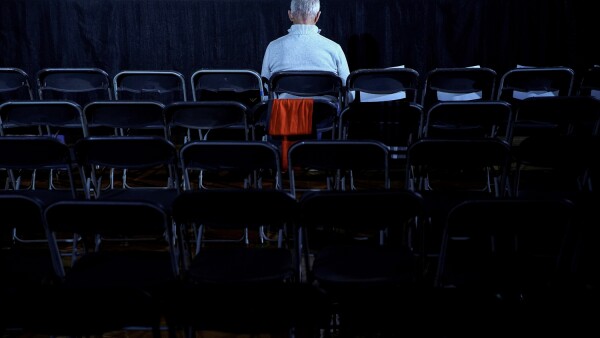 A man waits before the rally for Democratic presidential candidate Pete Buttigieg at Drake University in Des Moines in Des Moines, Iowa, U.S.,