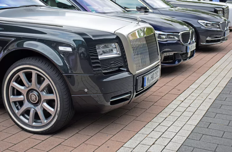 Rolls-Royce and BMW vehicles on the parking