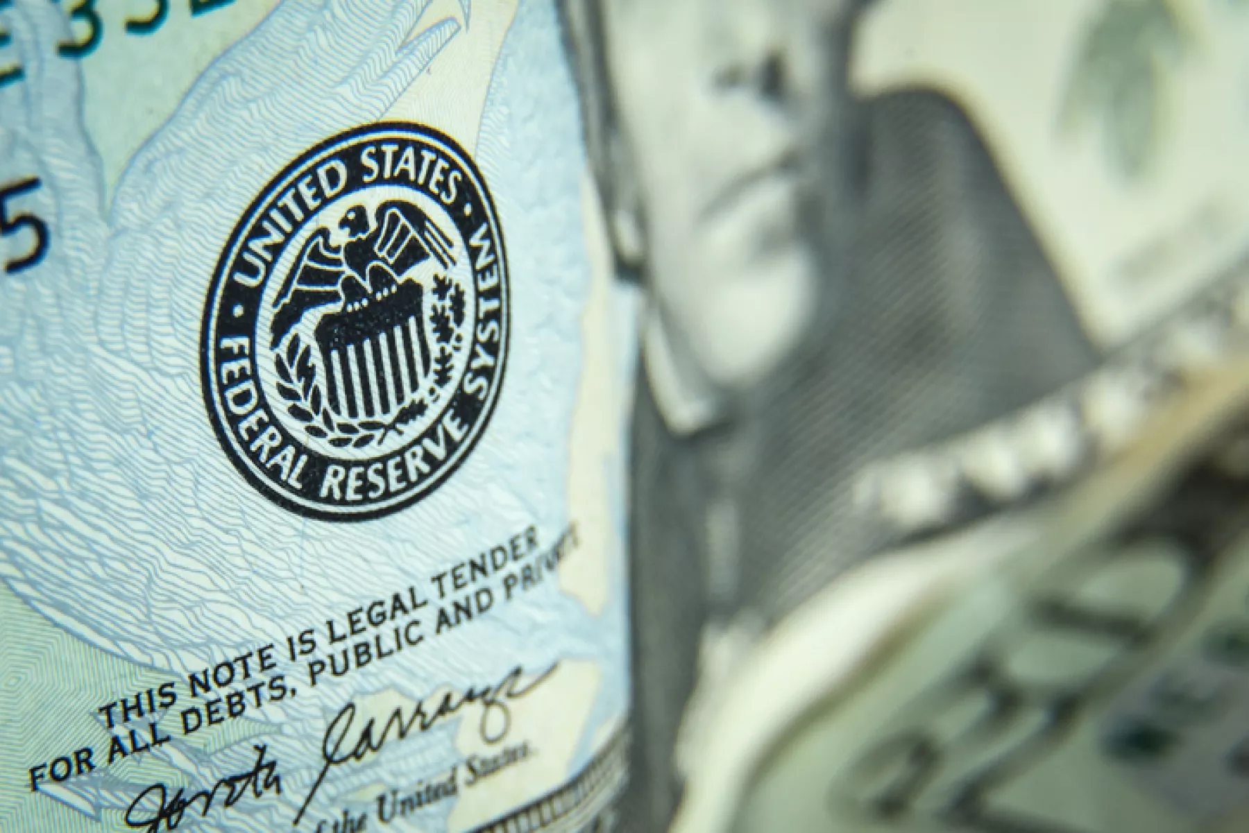 Twenty dollars bills - close up and reflection of US paper money