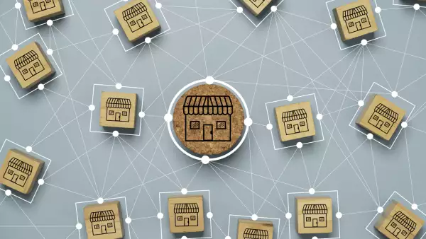 Business sale growth and expand shop franchise concept, Store illustration print screen on wooden cube block connection link with others shop and supermarket.