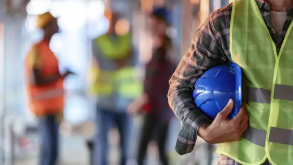 Man holding blue helmet close up