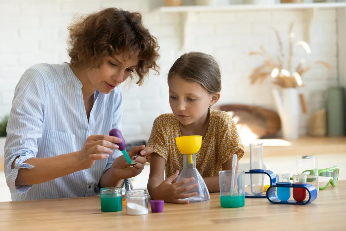 Little,Scientist.,Curious,School,Age,Daughter,Play,With,Mom,Engaged