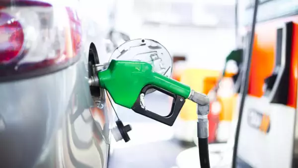 A close-up of a car being filled with gas