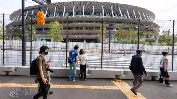 People walk past roads closures in preparation for the