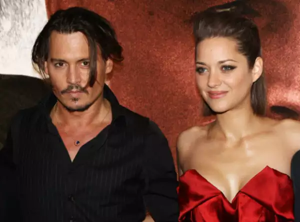 Marion Cotillard tuvo buena química con Johnny ientras filmaban Public Enemies, quizás más de la esperada.