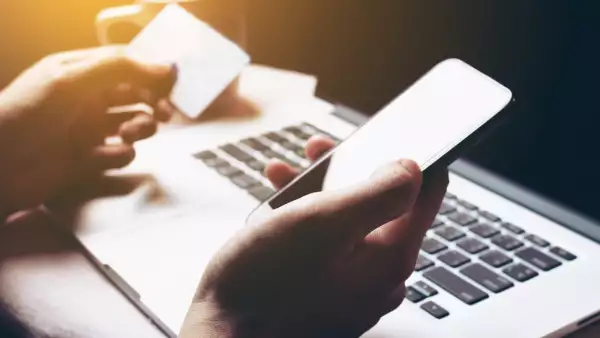 Woman using smartphone and login internet banking for shopping online.