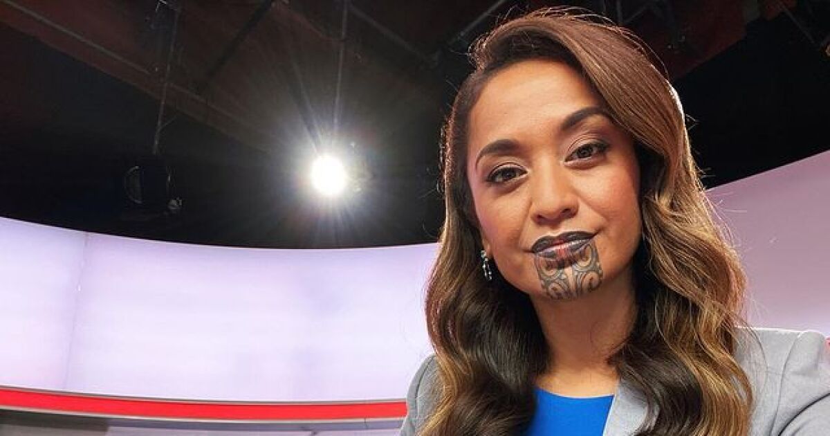 A news anchor in New Zealand appears with a tattooed face