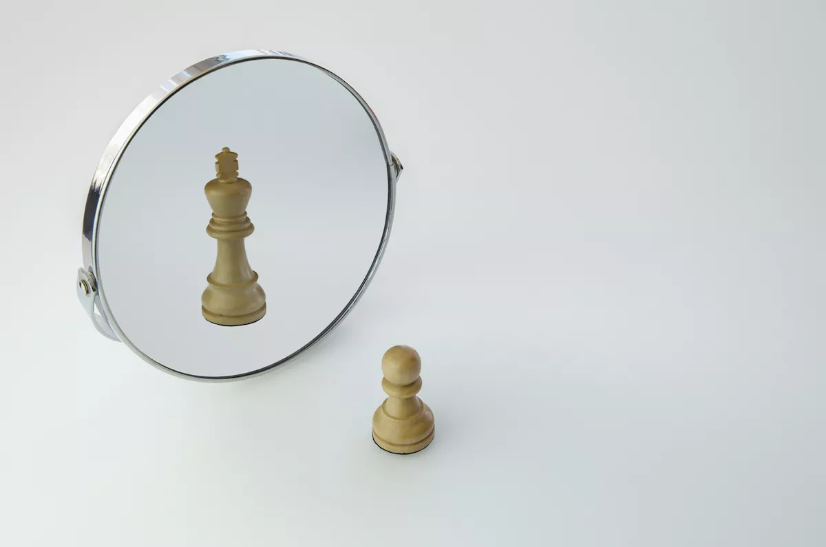 Chess Pawn imagining itself as a King,  pawn in a Mirror being a king