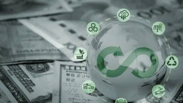 Símbolo de infinito con iconos de ESG sobre billetes de dólares.