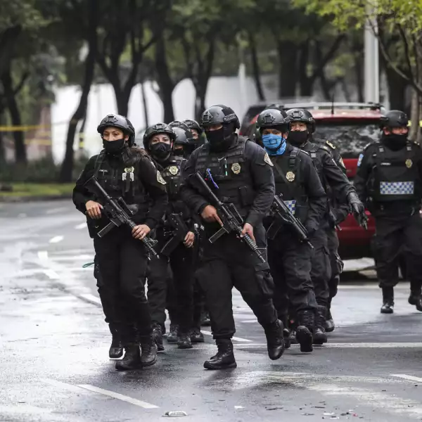 Police officers arrive at the area where a shooting took place in Mexico City