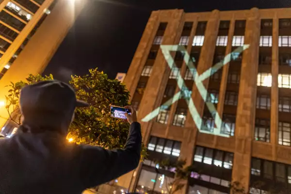 FILE PHOTO: Twitter's new logo is seen projected on the corporate headquarters building in downtown San Francisco, California