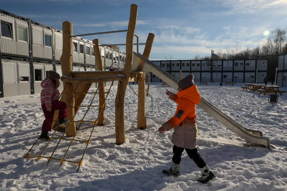 Children from Donbas region play near modular houses donated by the Polish government for Ukrainian internally displaced persons, amid Russia's attack on Ukraine, in Lviv, Ukraine February 9, 2023. REUTERS/Roman Baluk