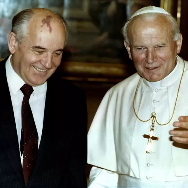 FILE PHOTO: Pope John Paul II talks with former Soviet President Mikhail Gorbachev during an audience at the Vatican