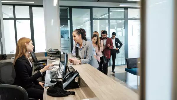 Business woman checking in to a hotel