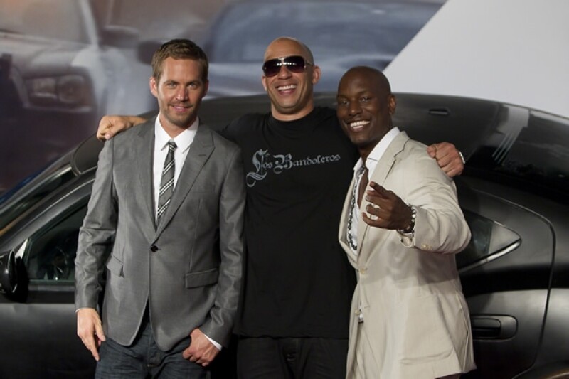 Paul con Vin Diesel y Tyrese Gibson en 2011.