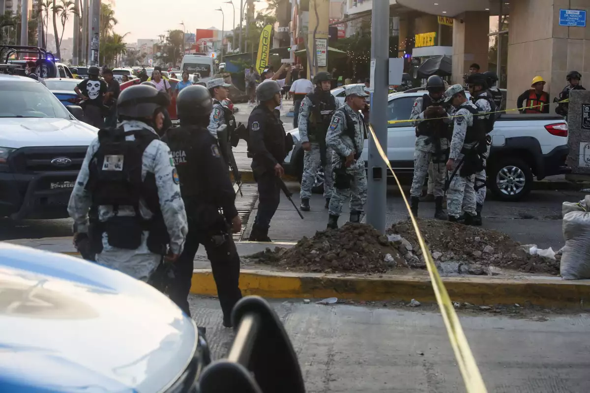 Security forces work at a crime scene, in Acapulco