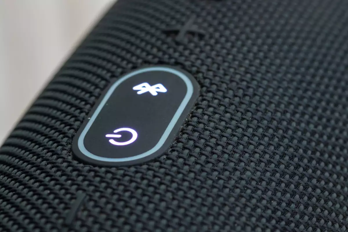 On-off and Bluetooth buttons on the portable boom box close up.