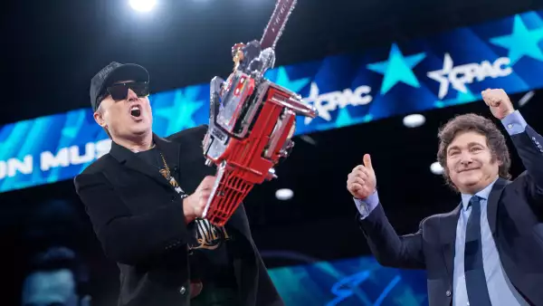 Elon Musk displays a chainsaw given to him by President of Argentina Javier Milei during the Conservative Political Action Conference (CPAC) in National Harbor, Maryland, U.S., February 20, 2025.