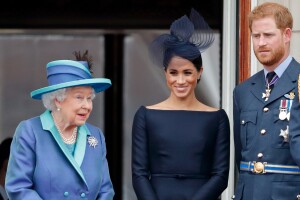 Reina Isabel, príncipe Harry y Meghan Markle