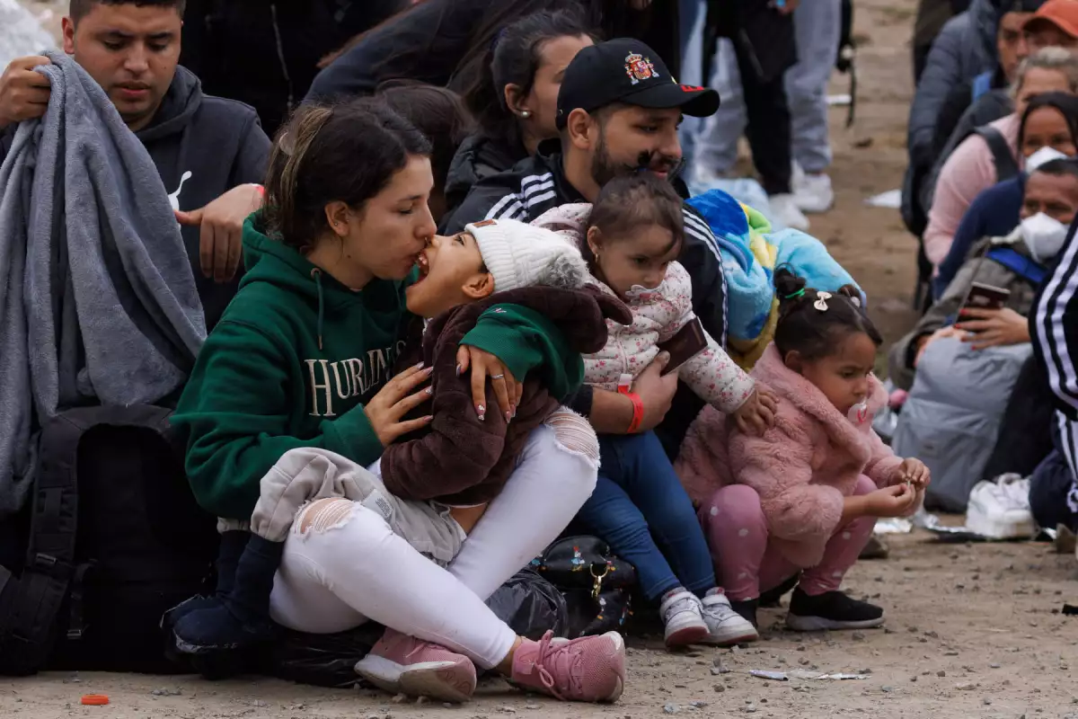 Migrants gather along the U.S. Mexico border near San Diego before the lifting of Tile 42
