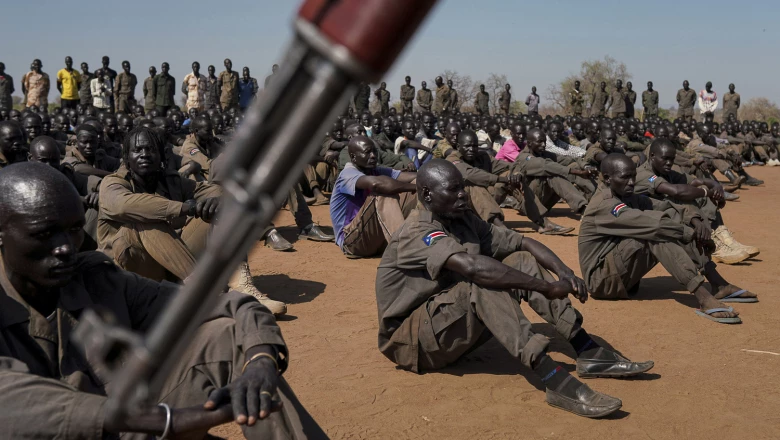 South Sudan soldiers gather at the training site for the joint force to protect VIPs in Gorom outside Juba