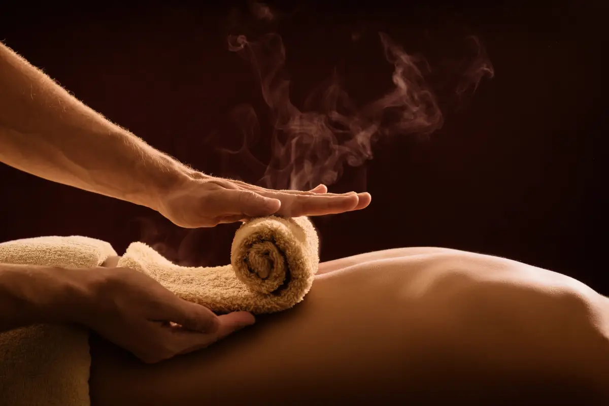 A,Professional,Therapist,Applies,A,Hot,Towel,On,The,Back