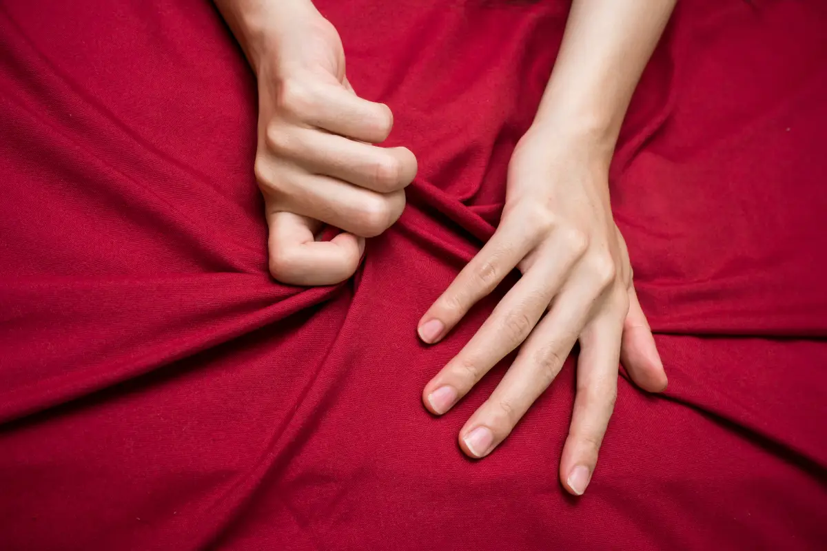 Woman,Hand,Sign,Orgasm,On,Bed