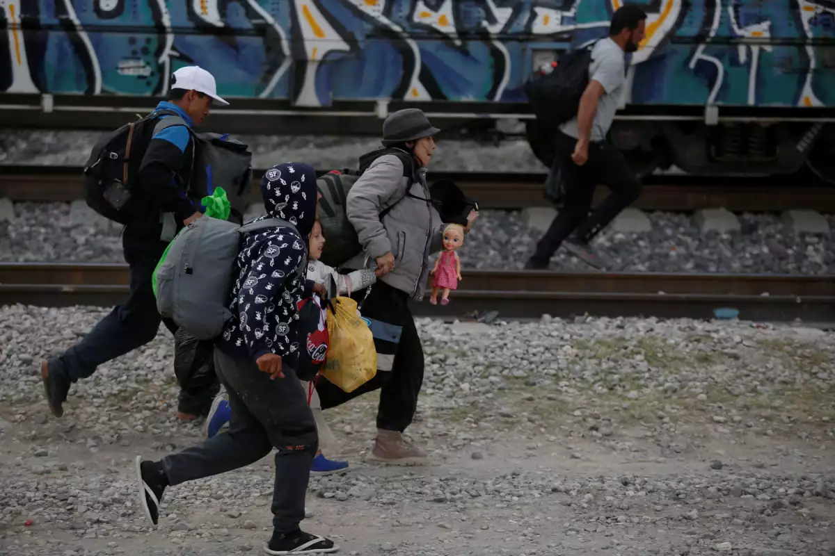 The Wider Image: Migrants risk life and limb to jump Mexico trains in rush to border