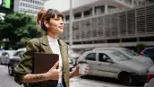 Business woman with tablet and coffee at Paulista Avenue in Sao Paulo , Brazil