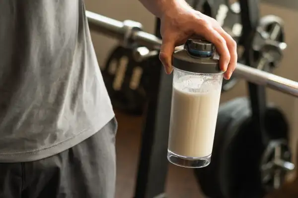 Close,Up,Of,Man,Hand,With,Protein,Shaker,At,Gym.