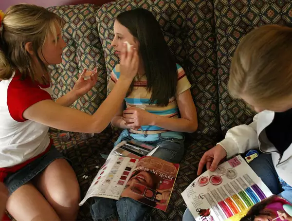 Megan Ver Steeg applies blush with a sponge to Alyssa Romberg's face (age 14 as Lexie Buccowich (rig