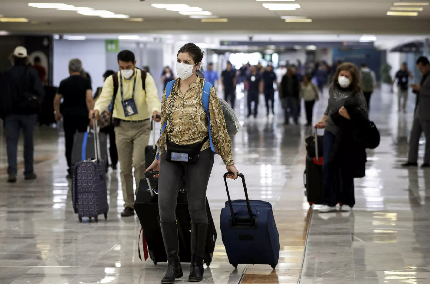 A stranded Peruvian tourist checks his phone at Cancun International Airport amid travel restrictions due to the outbreak of coronavirus disease (COVID-19) in Mexico